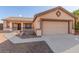 Charming single-story home with desert landscaping, covered porch, and attached two-car garage at 286 Fairmeadow St, Henderson, NV 89012