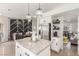 Open concept kitchen with a center island, granite countertops and stainless steel appliances at 286 Fairmeadow St, Henderson, NV 89012