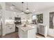 Modern kitchen featuring white cabinets, granite countertops, tile backsplash and stainless steel appliances at 286 Fairmeadow St, Henderson, NV 89012