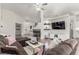 Open-concept living room with modern fireplace, sectional seating and decor accents at 286 Fairmeadow St, Henderson, NV 89012