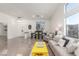 Bright living room with large window, tile flooring, and comfortable seating area at 286 Fairmeadow St, Henderson, NV 89012
