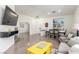 Open-concept living area with tile flooring, dining space, and contemporary decor at 286 Fairmeadow St, Henderson, NV 89012