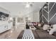 Bright living room featuring sleek tile flooring and contemporary decor with an oversized sectional at 286 Fairmeadow St, Henderson, NV 89012