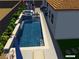 Backyard pool with a tanning ledge and in-pool seating, surrounded by tropical landscaping at 286 Fairmeadow St, Henderson, NV 89012