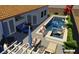 Modern backyard pool with a tanning ledge, in-pool seating, and outdoor entertaining area at 286 Fairmeadow St, Henderson, NV 89012