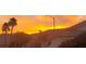 Beautiful sunset view over neighborhood homes and towering palm trees at 286 Fairmeadow St, Henderson, NV 89012