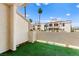 Private balcony with artificial turf, offering views of the community and palm trees at 3150 Soft Breezes Dr # 1037, Las Vegas, NV 89128