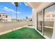 Private balcony with artificial turf, and sliding glass doors for indoor/outdoor living at 3150 Soft Breezes Dr # 1037, Las Vegas, NV 89128