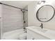 Updated bathroom featuring a tub and shower combination, modern vanity, and black hardware at 3150 Soft Breezes Dr # 1037, Las Vegas, NV 89128
