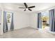 Bright bedroom featuring two large windows that offer neighborhood views and natural light at 3150 Soft Breezes Dr # 1037, Las Vegas, NV 89128