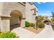 Building exterior featuring an arched doorway and covered entrance for residents at 3150 Soft Breezes Dr # 1037, Las Vegas, NV 89128