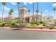 Community clubhouse featuring a tower element, portico entryway, and manicured landscaping at 3150 Soft Breezes Dr # 1037, Las Vegas, NV 89128
