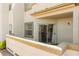 Exterior view of a private patio with a stucco privacy wall and a sliding glass door at 3150 Soft Breezes Dr # 1037, Las Vegas, NV 89128