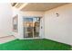 Cozy patio with sliding glass door leading to the interior of the home and view of the kitchen at 3150 Soft Breezes Dr # 1037, Las Vegas, NV 89128