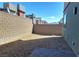A quaint backyard enclosed by brick walls, offering privacy and a blank canvas for personalization at 3210 Centano Ave, Henderson, NV 89044