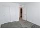A bedroom with a closet, doorway to the bathroom and gray carpet at 3210 Centano Ave, Henderson, NV 89044