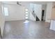 Bright living area with tile floors, stairs, and a ceiling fan at 3210 Centano Ave, Henderson, NV 89044