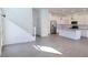Bright living area with stairs, tile floors, and an open layout to the kitchen with stainless steel appliances at 3210 Centano Ave, Henderson, NV 89044