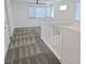 Upstairs loft space with geometric carpeting, a ceiling fan, and large window at 3210 Centano Ave, Henderson, NV 89044