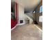 Bright living room with soaring ceilings, fireplace, and grand staircase at 357 Whispering Tree Ave, Las Vegas, NV 89183