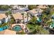 Stunning aerial view of home with pool, jacuzzi, mature palm trees, and lush green yard at 3633 Fox Heather Dr, Las Vegas, NV 89129