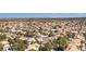 Extensive aerial view of a sprawling suburban area, blending residential homes and vibrant greenery at 3633 Fox Heather Dr, Las Vegas, NV 89129