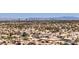 Panoramic aerial capturing a suburban neighborhood with a backdrop of city skyline and mountains at 3633 Fox Heather Dr, Las Vegas, NV 89129