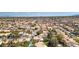 Vast neighborhood aerial showcasing closely-knit homes, mature trees, and a clear blue sky at 3633 Fox Heather Dr, Las Vegas, NV 89129
