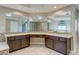 Elegant bathroom with a large vanity, dual sinks, granite countertops, and modern fixtures at 3633 Fox Heather Dr, Las Vegas, NV 89129