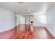 Large bedroom with hardwood floors, light blue walls, and a view to an adjacent bathroom at 3633 Fox Heather Dr, Las Vegas, NV 89129