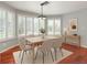 Bright dining room with plantation shutters, hardwood floors, and modern decor at 3633 Fox Heather Dr, Las Vegas, NV 89129