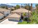 Charming two-story home featuring a tile roof, attached two-car garage, and well-maintained front lawn at 3633 Fox Heather Dr, Las Vegas, NV 89129