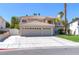 Expansive two-story home featuring a three-car garage and well-maintained landscaping at 3633 Fox Heather Dr, Las Vegas, NV 89129