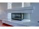 Close-up of the fireplace, showcasing the marble hearth and stone surround at 3633 Fox Heather Dr, Las Vegas, NV 89129