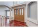 Bright foyer with double doors and elegant columns, leading to various living areas and bathed in natural light at 3633 Fox Heather Dr, Las Vegas, NV 89129