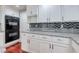 Kitchen with stainless steel double ovens, granite counters, and ample cabinet space at 3633 Fox Heather Dr, Las Vegas, NV 89129