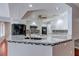 Kitchen with white cabinets, granite countertops, and stainless steel appliances at 3633 Fox Heather Dr, Las Vegas, NV 89129