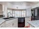 Kitchen area showcasing countertops, appliances, and sink with garden view at 3633 Fox Heather Dr, Las Vegas, NV 89129