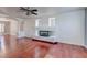 Spacious living room with a modern fireplace, hardwood floors, and ample natural light at 3633 Fox Heather Dr, Las Vegas, NV 89129