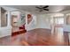 Expansive living room with hardwood floors, open layout, and views of the staircase and dining area at 3633 Fox Heather Dr, Las Vegas, NV 89129