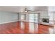Open living room boasts hardwood floors, fireplace and access to the backyard at 3633 Fox Heather Dr, Las Vegas, NV 89129
