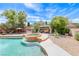 Inviting backyard featuring a pool, spa, gazebo, and lush landscaping, perfect for relaxation at 364 Clark Dr, Henderson, NV 89074