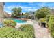 Beautiful backyard oasis featuring a sparkling pool, spa, covered gazebo, and lush landscaping at 364 Clark Dr, Henderson, NV 89074