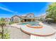 Expansive backyard with an inviting pool and spa, surrounded by a patio and landscaping, ideal for relaxation and outdoor enjoyment at 364 Clark Dr, Henderson, NV 89074