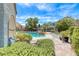 Serene backyard featuring a pool, spa, gazebo, and lush greenery, offering a private oasis at 364 Clark Dr, Henderson, NV 89074