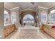 Relaxing bathroom highlighting a soaking tub, double sinks, and decorative molding at 364 Clark Dr, Henderson, NV 89074