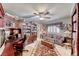 Spacious bonus room with built-in shelving, a large couch, and plenty of desk space at 364 Clark Dr, Henderson, NV 89074