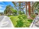 Picturesque community park featuring mature trees, green lawns, and pedestrian pathways for leisurely strolls at 364 Clark Dr, Henderson, NV 89074