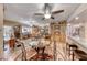 The dining area is open to the kitchen and features tile floors, a ceiling fan, and detailed wood trim at 364 Clark Dr, Henderson, NV 89074