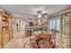 The dining area connects to the kitchen with tile floors, a glass table, and a ceiling fan at 364 Clark Dr, Henderson, NV 89074